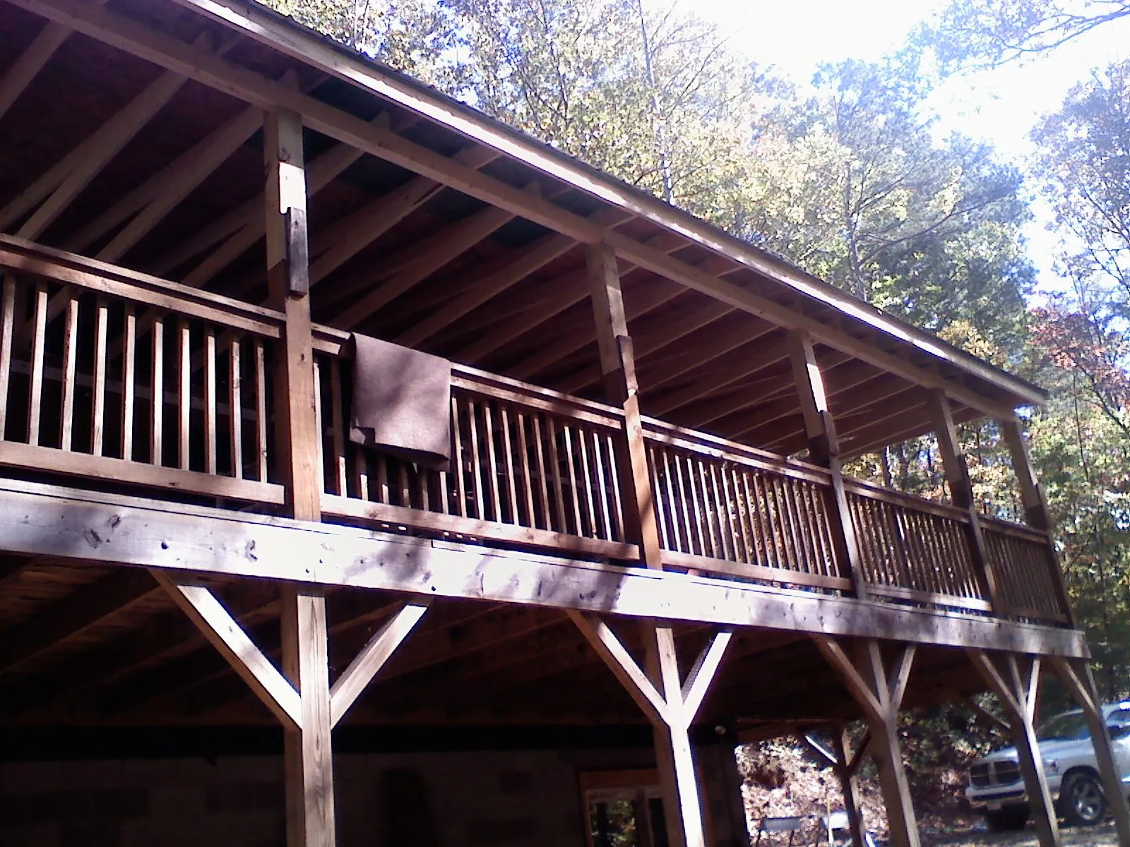 Timber framing under a new elevated porch and deck — Roof Leak Repair in Wichita by Roofing Brothers